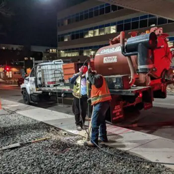 Municipal nighttime maintenance workers operating