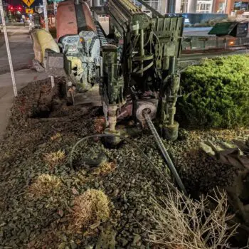 Construction drilling machine at night