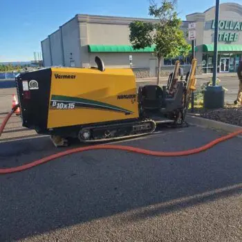 Trenching machine on asphalt parking