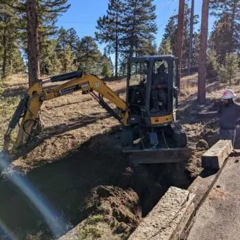 Excavation equipment digging residential trench