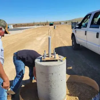 Construction site workers concrete foundation