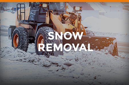 Bulldozer clearing snowy road