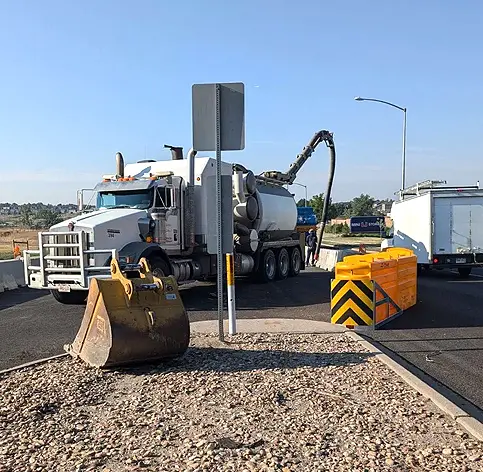 Vacuum truck on road project