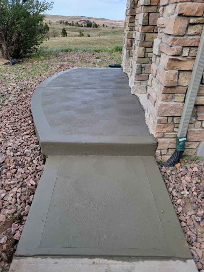 Stained concrete walkway leading edge
