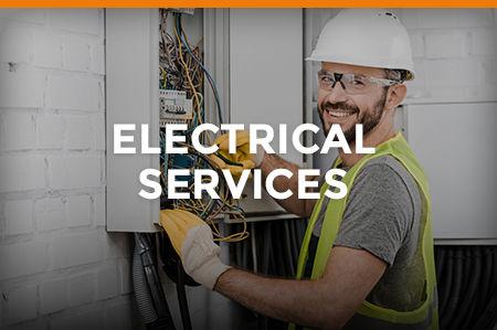 Electrician working electrical panel