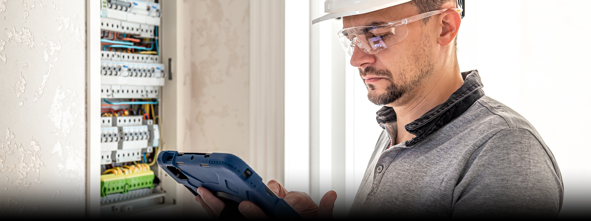 Electrician inspecting electrical panel