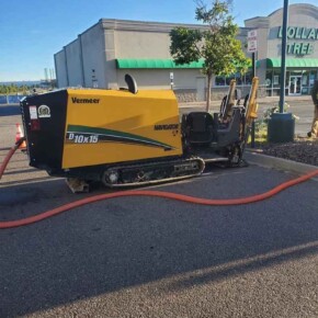 Trenching machine on asphalt parking