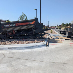 Construction machinery near white truck