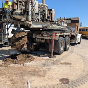 Drilling rig excavating with auger